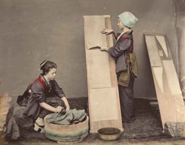 [Two Japanese Women Posing with Laundry], 1870s.