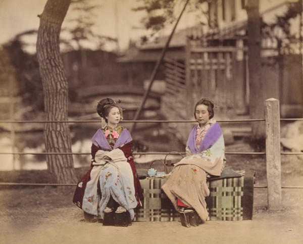 [Two Japanese Women Sitting on a Bench], 1870s.