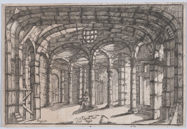 Interior of a prison in which sits a woman