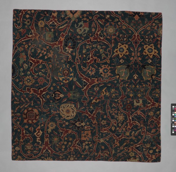 Blue-ground Carpet Fragment with Scrolling Floral Vines, Iran, 17th century.