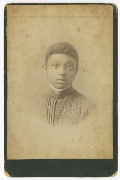 Photograph of a girl wearing a pleated dress, 1885-1900. Creator: Unknown.