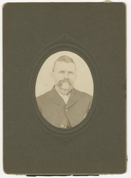 Photograph of a man with a mustache wearing a dark jacket, late 19th century. Creator: Unknown.