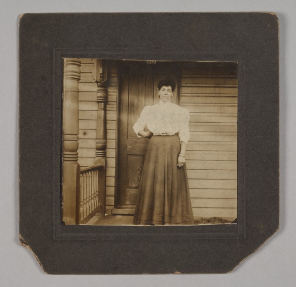 Photographic print of a woman on a porch, early 20th century. Creator: William O. Turner.