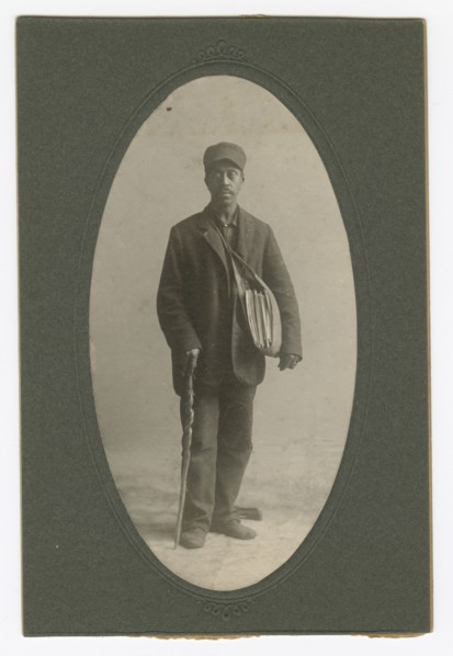 Cabinet card of a newspaper carrier, mid to late 19th century. Creator: Unknown.