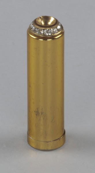 Metal lipstick holder from Mae's Millinery Shop, 1941-1994. Creator: Unknown.