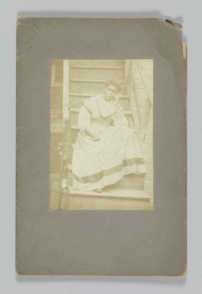 Albumen print of an unidentified woman sitting on stairs, 1850-1895. Creator: Unknown.