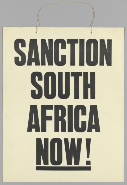 Placard reading "Sanction South Africa Now!", late 20th century. Creator: Unknown.