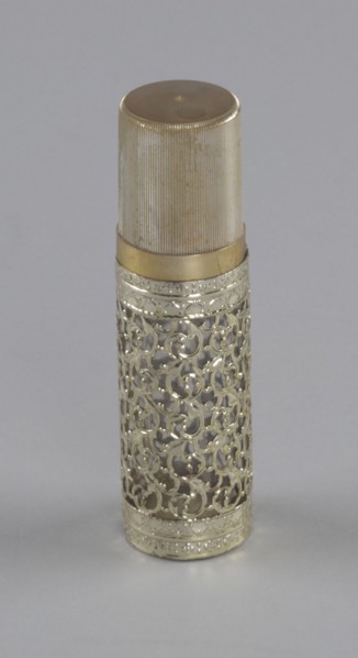 Gold and glass perfume bottle from Mae's Millinery Shop, 1941-1994. Creator: Anne Paree.