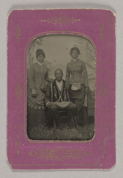 Tintype photograph of a man identified as James Turner, with two women, ca. 1873. Creator: H.G. Pearce.