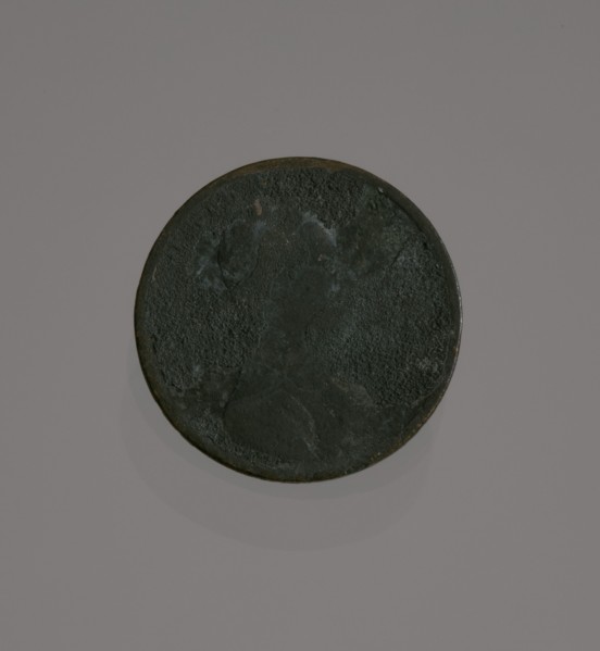 Riot penny charred during the 1921 Tulsa Race Massacre, 1909-1921. Creator: United States Mint.
