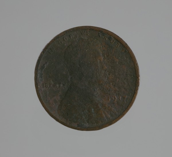 Riot penny charred during the 1921 Tulsa Race Massacre, 1917. Creator: United States Mint.