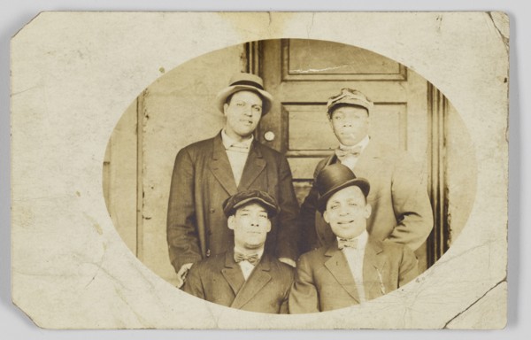 Photographic postcard of four unidentified men, 1906-1915. Creator: Unknown.