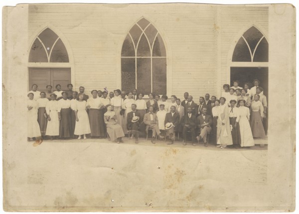 Photographic print of men and women in front of Vernon AME Church, Tulsa, ca. 1919. Creator: Unknown.
