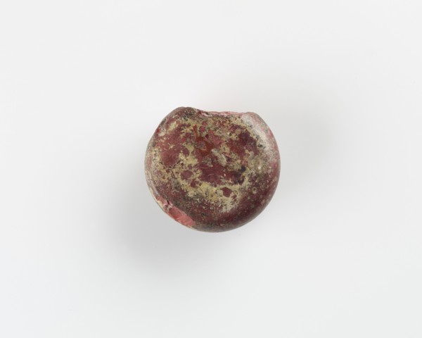 A round marker for games. Chipped, Roman period, (3rd-4th century?). Creator: Unknown.