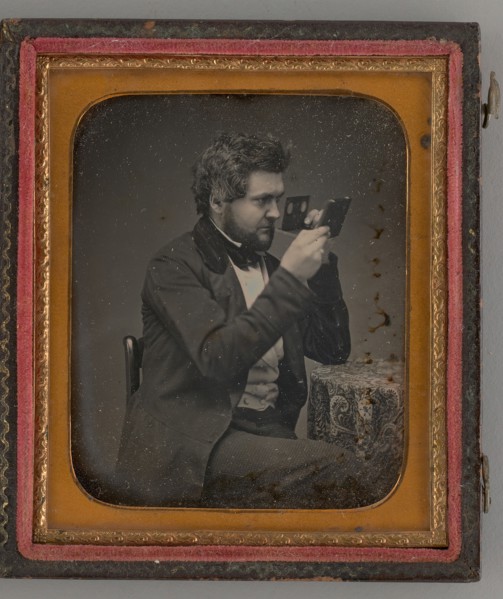Untitled (Portrait of Man Looking Through a Stereoscope), 1856. Creator: Unknown.