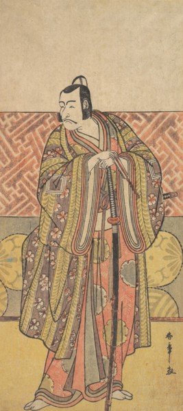 Ichikawa Danjuro V as Kudo Suketsune, Richly Attired, Leaning on His Sword, late 18th century. Creator: Shunsho.