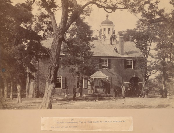 Fairfax Court House, Virginia, with Union Soldiers in Front and on the Roof, 1863. Creator: Mathew Brady.