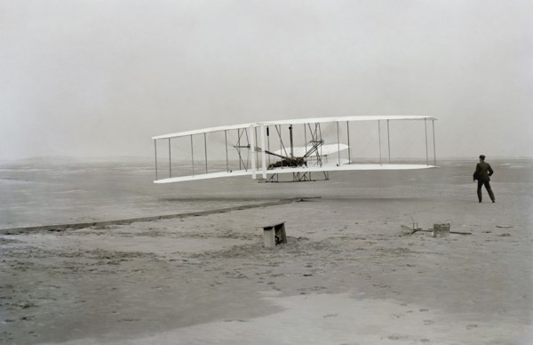 First flight of Wright brothers aircraft, Kitty Hawk, North Carolina, USA, December 17, 1903.  Creator: Unknown.