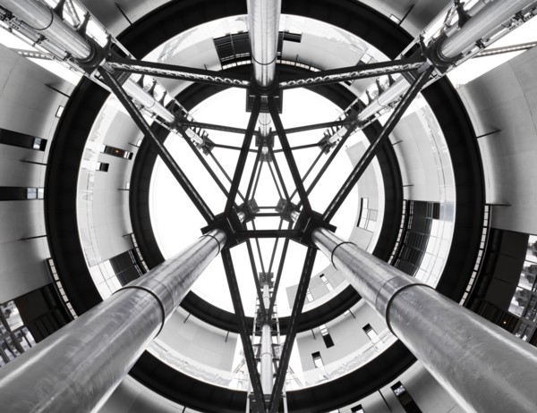 Gasholder Park, King's Cross, Camden, London, 2018. Interior view looking up through the open axis area at the centre of the three interlinked former gasholders, redeveloped as residential housing, 20...