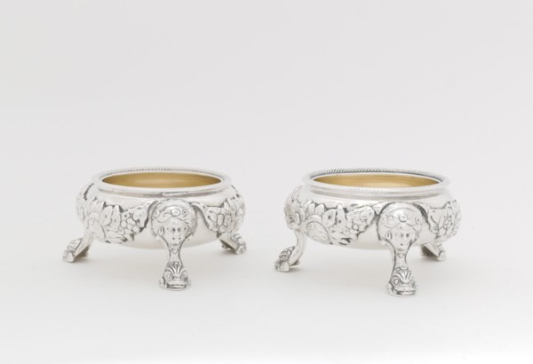 Pair of Salts, 1790/95. Legs in the form of a human face with stylised dolphin or fish at the foot.