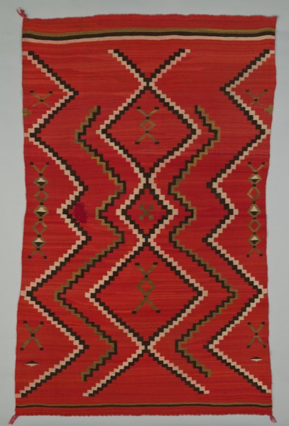 Sarape with Terraced Zigzag Design, 1865/85. A work made of wool, plain weave and dovetail tapestry weave; twined warp ends and selvages; looped and knotted corner tassels.