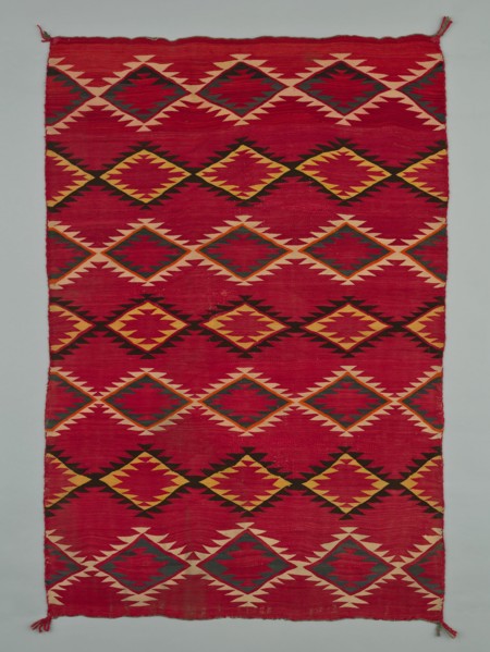 Sarape with Serrated Diamond Pattern, 1880/1900. A work made of wool, plain weave with "lazy lines" and dovetail tapestry weave; twined warp ends and selvages; looped and knotted corner tassels.