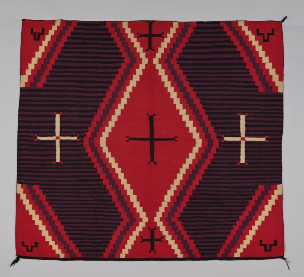 Chief Blanket (Third Phase), c. 1880. A work made of wool, dovetail tapestry weave with "lazy lines"; twined warp ends and selvages; corner tassels.