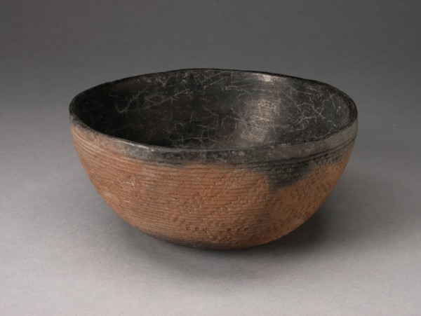 Bowl with Textured Surface Decoration in Basketry-Like Pattern, A.D. 900/1000. Round, red-brown bowl with small cracks its black interior. The outer surface is striated with tight horizontal lines and...