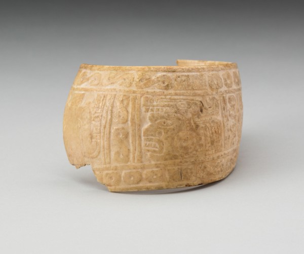 Shell, Possibly an Arm Band, Incised with Profile Head Framed by Geometric Motifs (Fragment), c. A.D. 1200.