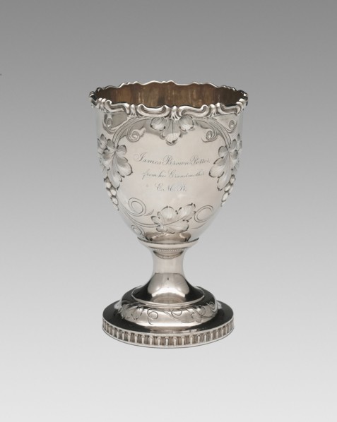 Goblet, 1852. Relief decoration of grapes and vine leaves, inscribed: 'James Brown Potter, from his Grandmother E.M.B.'.
