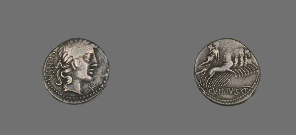 Denarius (Coin) Depicting the God Apollo, 90 BCE. Silver coin with a face in profile on one side, a figure riding a chariot pulled by four horses on the reverse.