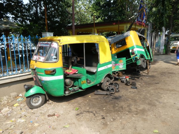 Tuk Tuk roadside repairs, India.
