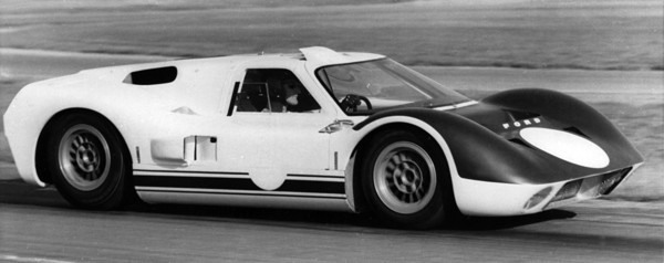 British racing driver and engineer Ken Miles driving a 1966 Ford GT40 J racing car. Creator: Unknown.