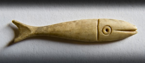Detail of a fish-shaped bone gaming piece from Portchester Castle, Fareham, Hampshire, 2009. Creator: Derek Kendall.