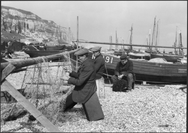 Fishermen mending nets on the beach, Hastings, East Sussex, 1925-1939. Creator: J Dixon Scott.