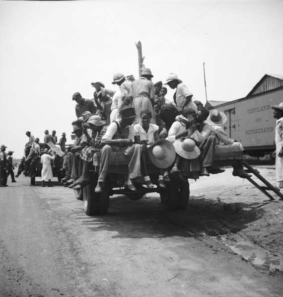 Peach pickers being driven to the orchards, Muscella, Georgia, 1936. Creator: Dorothea Lange.