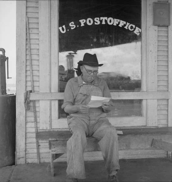 Man in front of post office, Carey, Texas, 1937. Creator: Dorothea Lange.