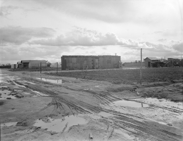 Freightcar converted into home in "Little Oklahoma", California, 1936. Creator: Dorothea Lange.