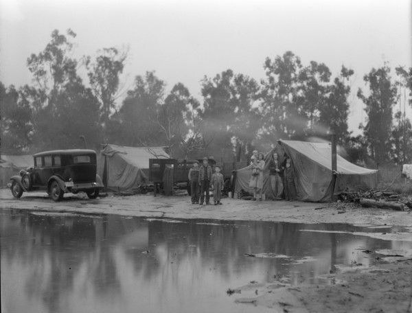 Migrant pea pickers camp in the rain, California, 1936. Creator: Dorothea Lange.