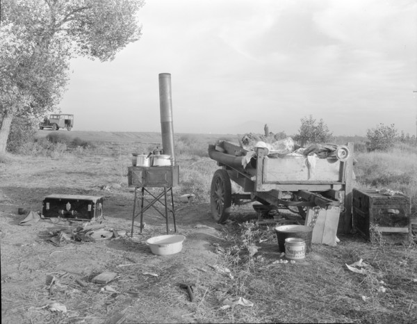 Migratory workers' "kitchen" near Shafter, Kern County, California, 1936. Creator: Dorothea Lange.