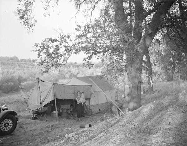Wife and child of migrant worker, encamped near Winters, California, 1936. Creator: Dorothea Lange.