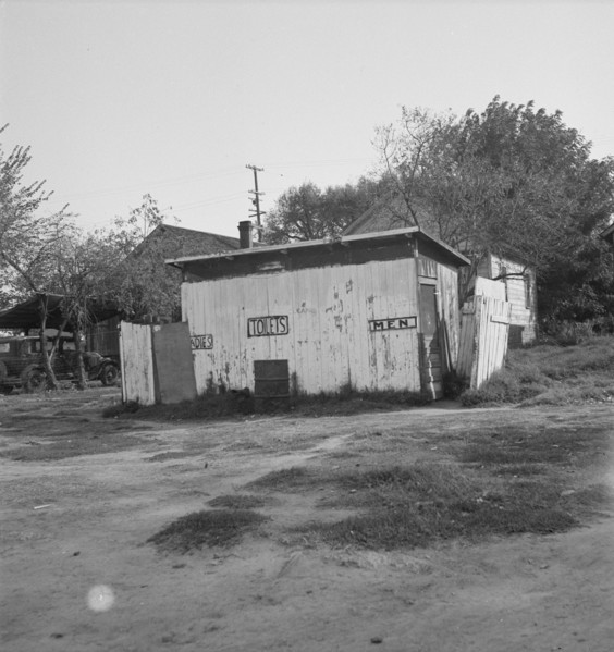 Privy in cheap migratory camp, San Joaquin Valley, California, 1936. Creator: Dorothea Lange.