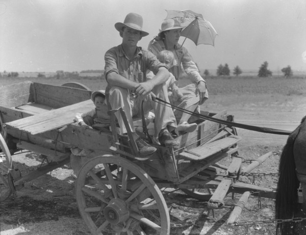 Drought-stricken farmer and family near Muskogee, Oklahoma, 1939. Creator: Dorothea Lange.