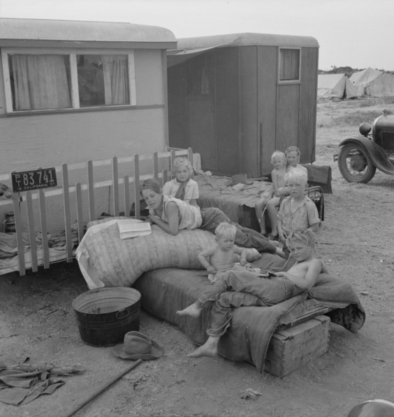 Children from Chickasaw, Oklahoma, in a potato pickers' camp near Shafter, California, 1937. Creator: Dorothea Lange.