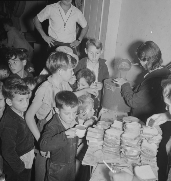 The children at Halloween party in Shafter migrant cooperative, California, 1938. Creator: Dorothea Lange.