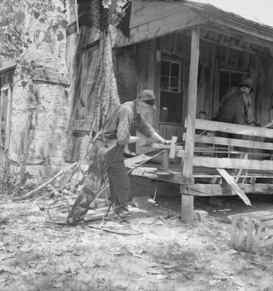In Arkansas Hills (Ozarks) near Seligman, Missouri, splitting hickory for chair-bottoms, 1938. Creator: Dorothea Lange.