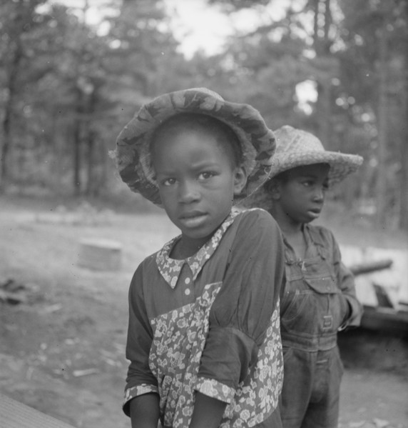 Possibly: Grandchildren of tobacco sharecropper down at barns, Wake County, North Carolina, 1939. Creator: Dorothea Lange.