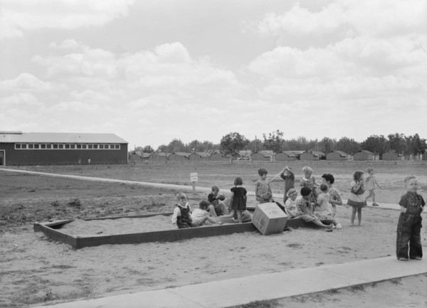 Nursery school children with their teacher, FSA camp, Tulare County, California, 1939. Creator: Dorothea Lange.