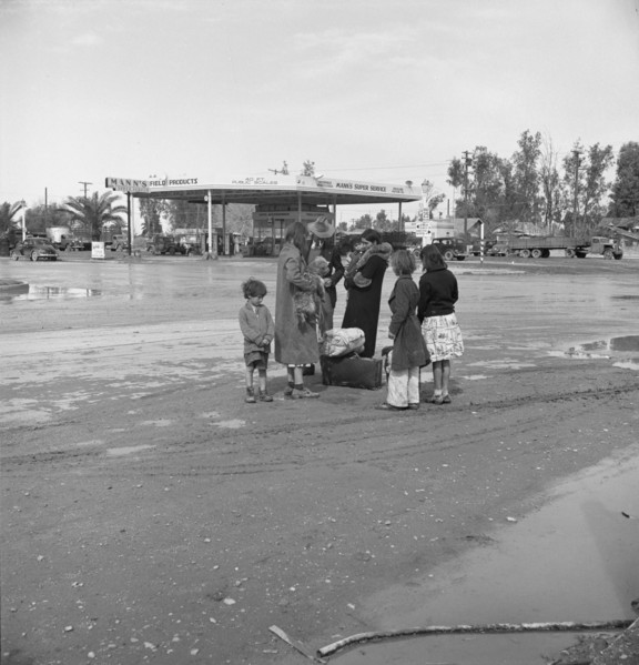 Family of homeless, walking people are left at the edge of the next town, 1939. Creator: Dorothea Lange.