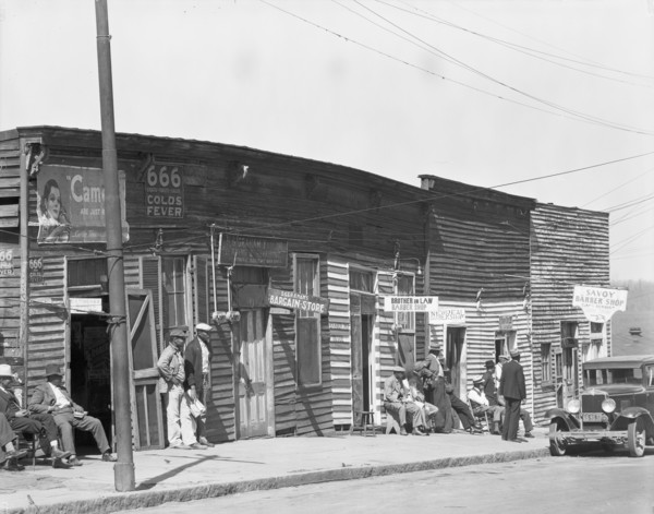 Vicksburg Negroes and shop front, Mississippi, 1936. Creator: Walker Evans.